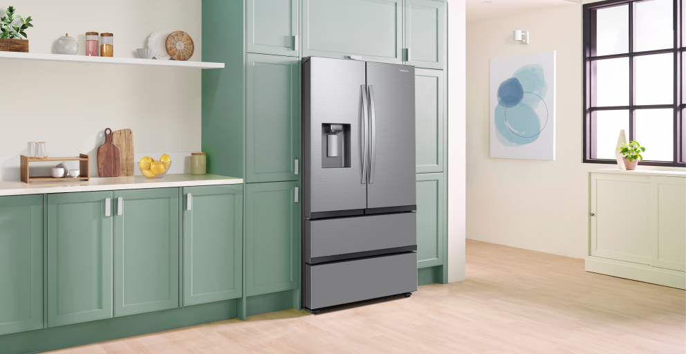 stainless steel fridge with modern green kitchen cabinets